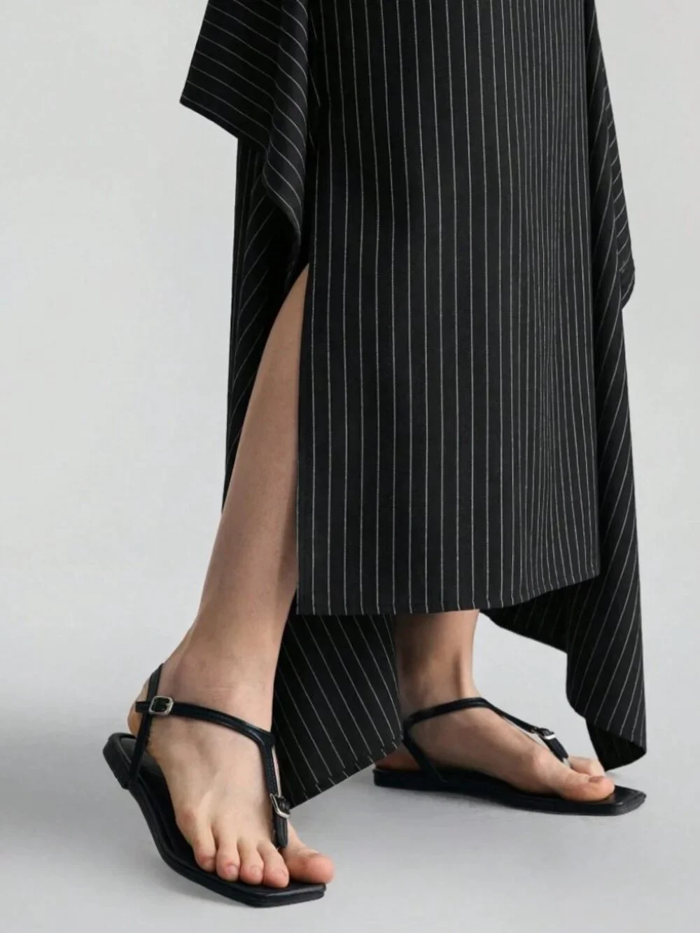 Black Pinstripe Asymmetric High-Slit Maxi Skirt